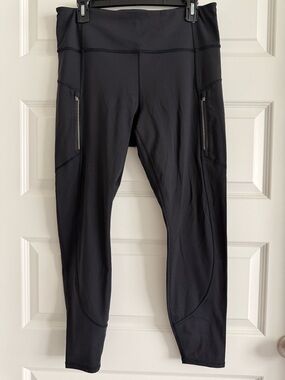 Athleta Black Rainier Leggings with Zip Pockets and reflective dots! Size Large.